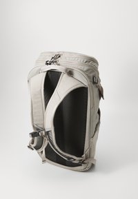 Light gray backpack with a structured shape, durable fabric, dual zipper closure, padded back, and adjustable straps for comfort.