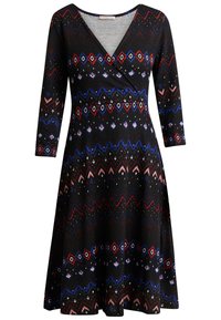 Vestido negro con escote en V, mangas tres cuartos y falda acampanada. El tejido está adornado con patrones geométricos coloridos y puntos.