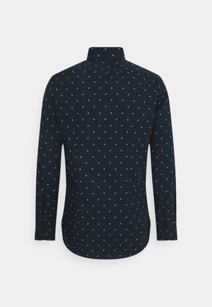 Men’s long-sleeve dark navy shirt with small white diamond pattern, shown from the back on a plain light background.