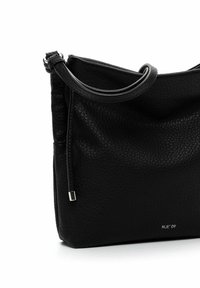 Black leather handbag with a pebbled texture, single shoulder strap, and a subtle silver logo detail at the bottom right.