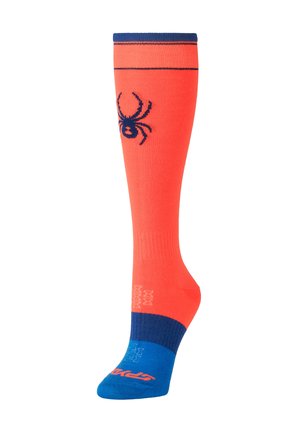 Chaussette haute orange vif avec pointe, talon et bord-côte bleus, et un graphisme araignée noire sur le mollet.