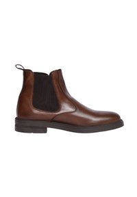 Stivale alla caviglia in pelle marrone con pannelli elastici laterali, punta arrotondata e linguetta. Presenta un elastico nero testurizzato per flessibilità e comfort.