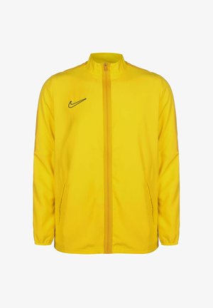 Gelbe Nike-Jacke mit Stehkragen, Frontreißverschluss, zwei Seitentaschen und einem schwarzen Swoosh-Logo auf der linken Brustseite.