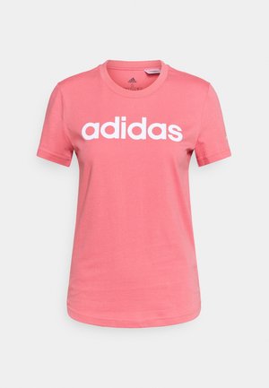 Rosa Adidas T-Shirt mit kurzen Ärmeln und Rundhalsausschnitt, weißes Adidas-Logo mittig auf der Brust, vor einfachem Hintergrund.