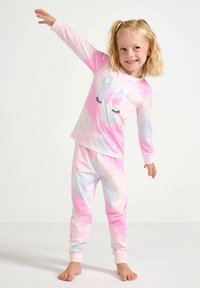 Yksisarvisaiheinen pyjamasetti pastellinvaaleanpunaisen ja sinisen liukuvärissä. Pitkähihainen yläosa, jossa yksisarvinenkuva; housuissa kuminauhakärjet.