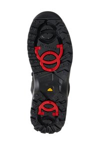 Černá gumová podrážka boty s profilovaným vzorem pro lepší přilnavost, dvěma červenými kruhovými kovovými komponenty a žlutým logem.