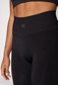 Champion SEAMLESS LEGGINGS SHOCK ABSORBER - Tamprės - black