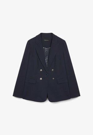 Laivastonsininen kaksirivinen bleiseri hopeisilla napeilla, kärkikauluksilla, etutaskuissa läppä, ja kuvioitu vuori.