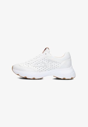 White athletic shoes with a textured, perforated material, featuring a thick rubber sole and subtle tan accents on the heel and logo.