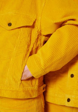 Spijkerjas - yellow