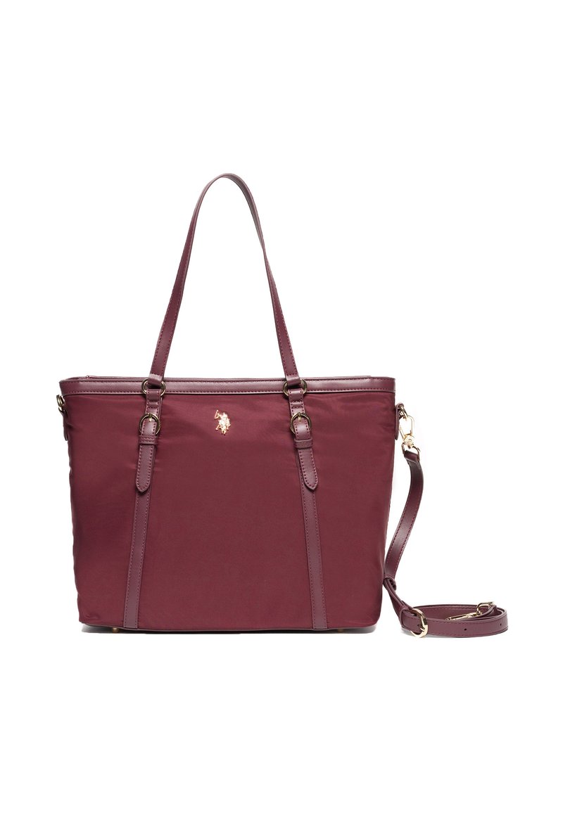 Burgundská nylonová taška s dvojitými vrchními rukojeťmi a odnímatelným ramenním popruhem. Obsahuje zlaté kovové detaily a logo na přední straně.