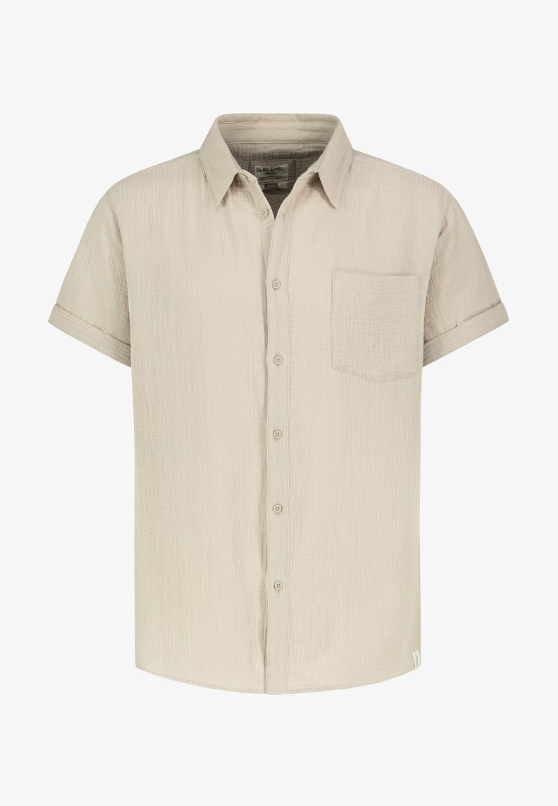 Kurzärmeliges, knöpfbares Hemd aus hellem, beigem, strukturiertem Stoff, mit einer Brusttasche und einem klassischen Kragen.