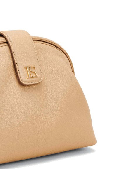 Beige faux leather handbag with a rounded shape, featuring a prominent flap and embossed initials "JS" in gold. Textured surface detail visible.