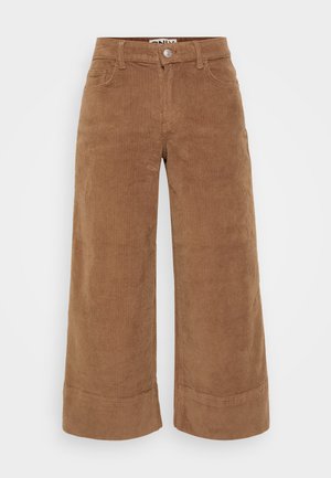 Brown corduroy wide-leg trousers with a high waist, featuring front pockets and a button closure. Textured ribbed fabric and rolled cuffs.
