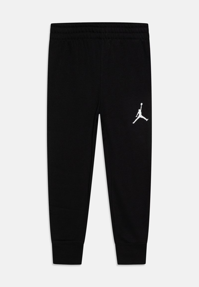 Pantaloni sportivi neri realizzati in tessuto morbido, con una fascia elastica in vita, polsini alla caviglia e un logo Jumpman bianco sulla coscia sinistra.