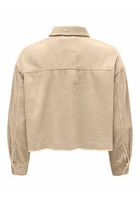 Veste en velours côtelé beige à manches longues, poignets boutonnés et ourlet droit vue de dos.