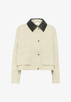 Heledbeez värvi lühike jakk musta nahkvari käeümbruses, nööbiga sulgemine ja kaks esipaneeli taskut klapiga. Puuvillane materjal.