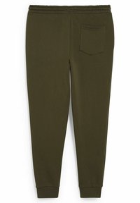 Olivgrüne Sweatpants aus weichem Stoff, mit einem elastischen Bund, gerippten Knöcheln und einer einzelnen, abgerundeten Gesäßtasche.