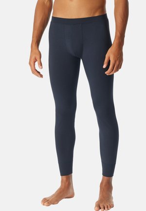 Leggings azul marino hechos de tela elástica, con un ajuste ceñido, una cinturilla suave y puños en el dobladillo. Diseñados para comodidad y flexibilidad.