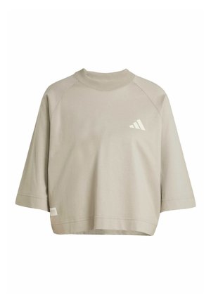 Lys beige cropped sweatshirt med ribbet rund hals, raglanærmer og subtil hvid logo-detalje foran. Blød tekstur.