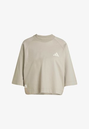 Ljusbeige kort sweatshirt med ribbad rund hals, raglanärmar och subtil vitt logotypdetalj fram. Mjuk textur.