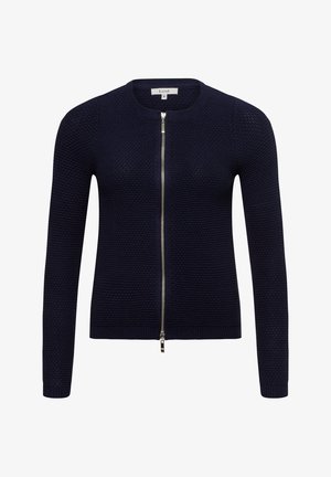 Marineblauwe gebreide cardigan met een ronde hals, lange mouwen en een ritssluiting. Heeft een textuurstof en een ribbelzoom.