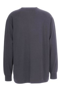 Dark gray long-sleeve shirt made from soft fabric. Features a crew neck, relaxed fit, and ribbed cuffs. Plain design, no patterns or accents.