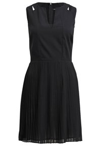 Robe noire sans manches avec encolure en V, bretelles découpées aux épaules, corsage ajusté et jupe plissée, fermeture éclair dans le dos.