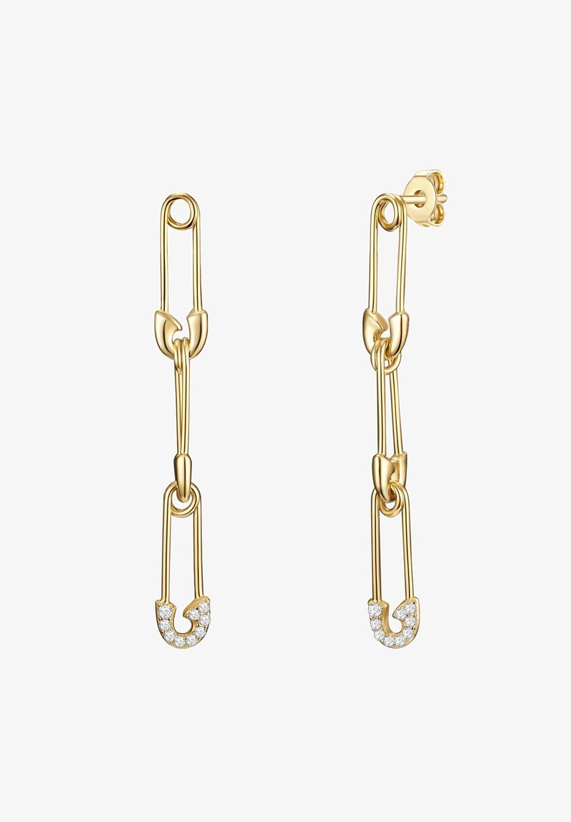 Zelta toņa auskari, kas veidoti kā drošības adatas, ar gludu apdari un maziem caurspīdīgiem akmentiņiem apakšējā adatā. Elegants un minimālistisks dizains.