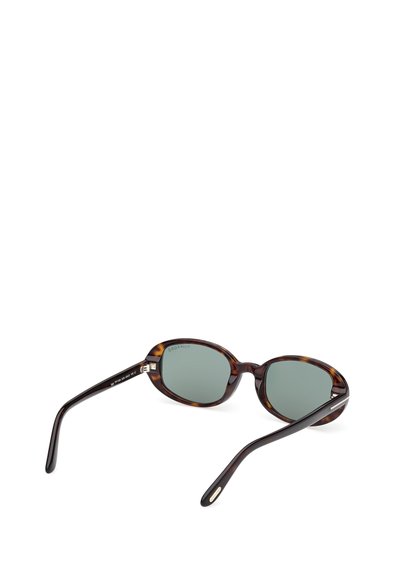 Gafas de sol con montura carey y lentes verdes, forma ovalada, varillas delgadas y detalles metálicos cerca de las sienes. Diseñadas para la protección visual.