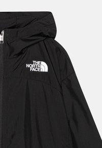 The North Face NEVER STOP - Cortaviento - black