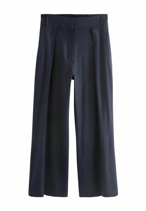 Mørkeblå vide bukser med frontplisser, elastik i taljen og bæltestropper, lavet af glat stof.