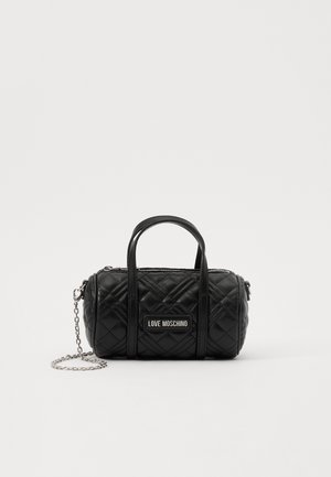Black quilted cylindrical handbag with short handles, silver chain strap, and "Love Moschino" logo plaque on the front.