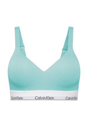 Lyseblå myk stoff-bh med V-halsdesign, brede stropper og en hvit underkant med svart "Calvin Klein"-logo.