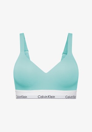 Bralette in morbido tessuto blu chiaro con design a V, spalline larghe e un elastico bianco con il logo nero "Calvin Klein".