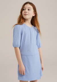 Light blue short dress with textured fabric, puff sleeves, and decorative sparkles. Fitted design with a waist seam and subtle sheen.