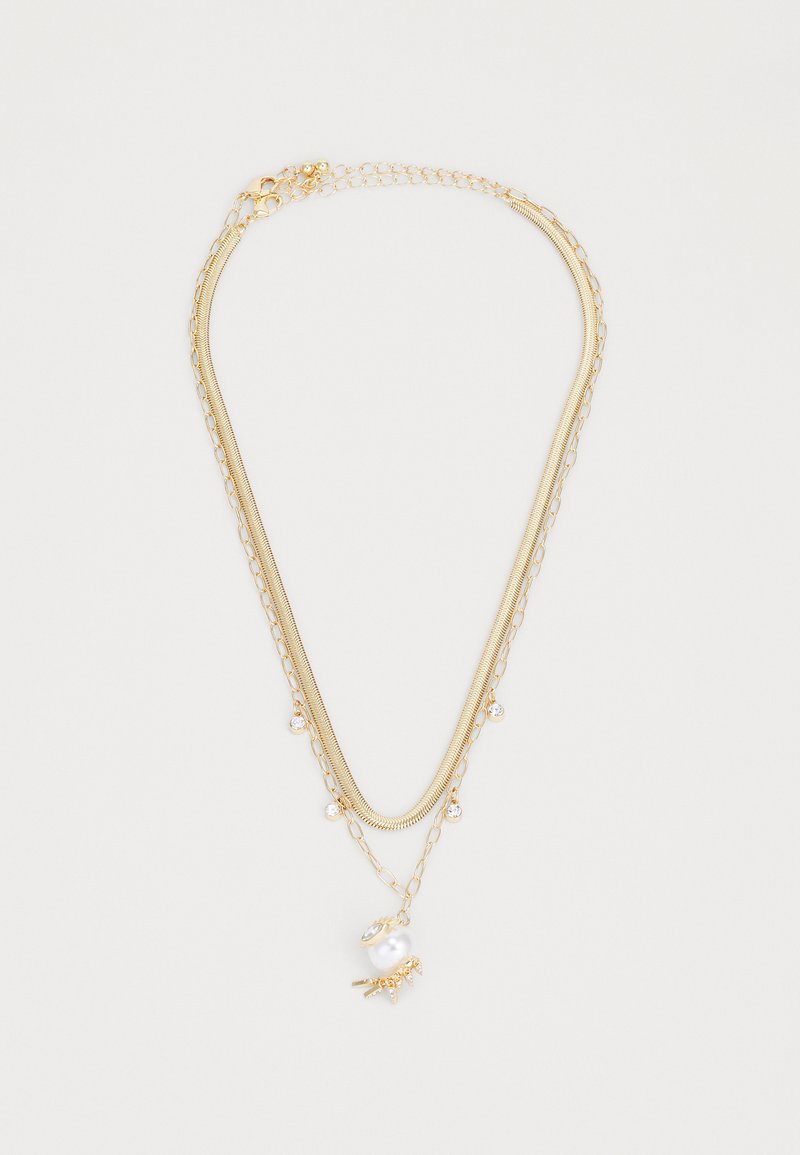 Gold-tone layered necklace featuring a smooth chain, delicate pearls, and crystal accents. Includes a lobster clasp and adjustable length.