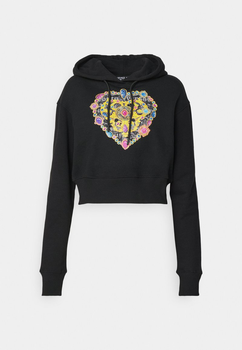 Le hoodie cropped noir présente un design de cœur coloré avec des motifs complexes et des accents ressemblant à des gemmes. Inclut une capuche à cordon et des poignets côtelés.