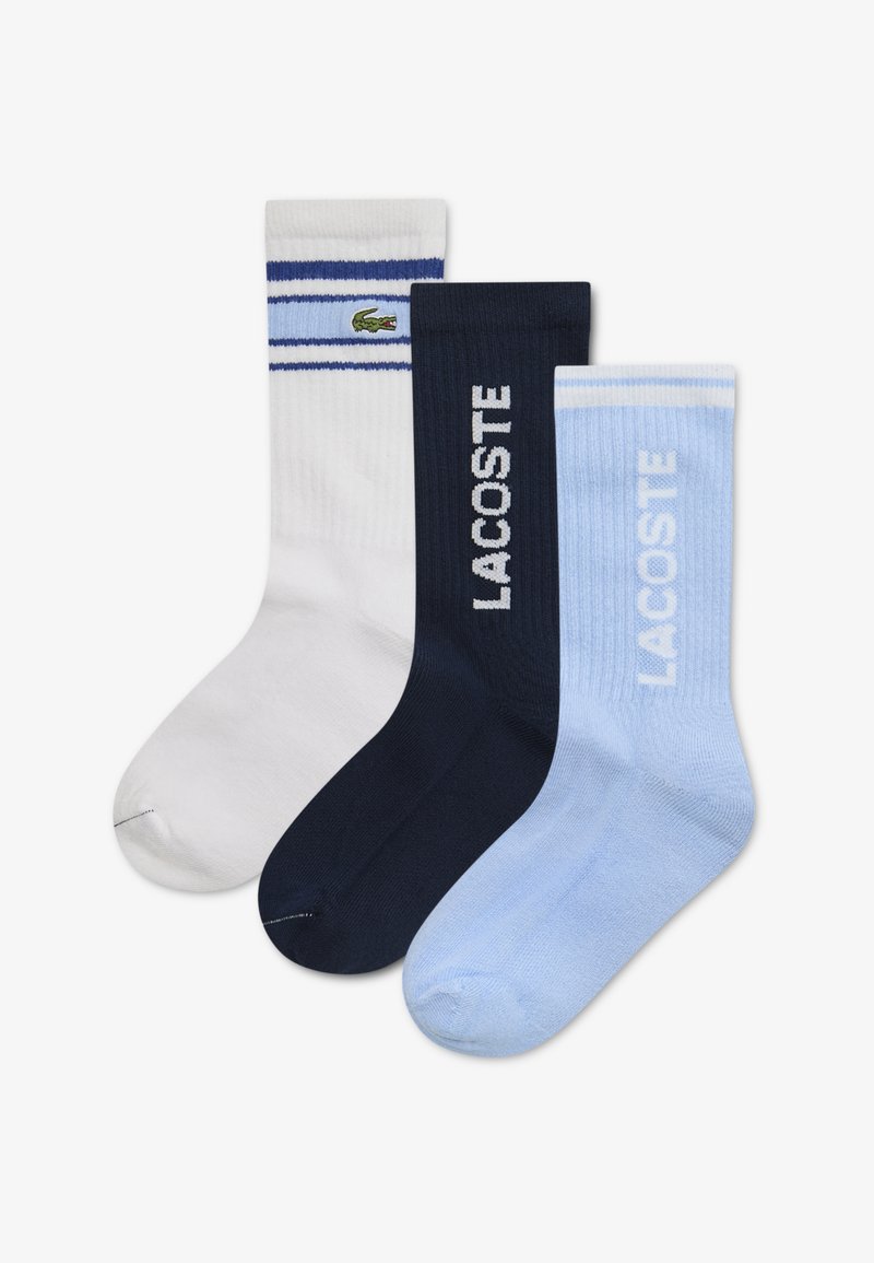 Három pár bokazokni: fehér kék csíkokkal, sötétkék és világoskék "LACOSTE" logóval. Pamutkeverék, bordás mintázatú.