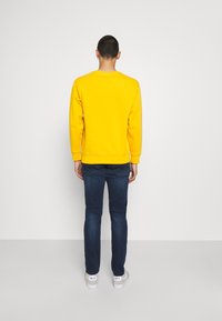 Replay ANBASS - Calças de ganga de perna direita - dark-blue denim