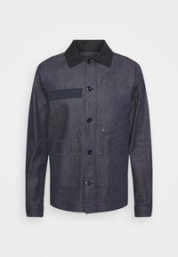 Dark blue jacket made of textured fabric, featuring a collared neckline, front button closure, and multiple pockets with a patch on the chest.