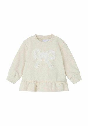 Helle beige Sweatshirt mit langen Ärmeln, gerafftem Saum und einer Spitzenbogen-Applikation in der Mitte. Weiche Textur und runder Halsausschnitt.