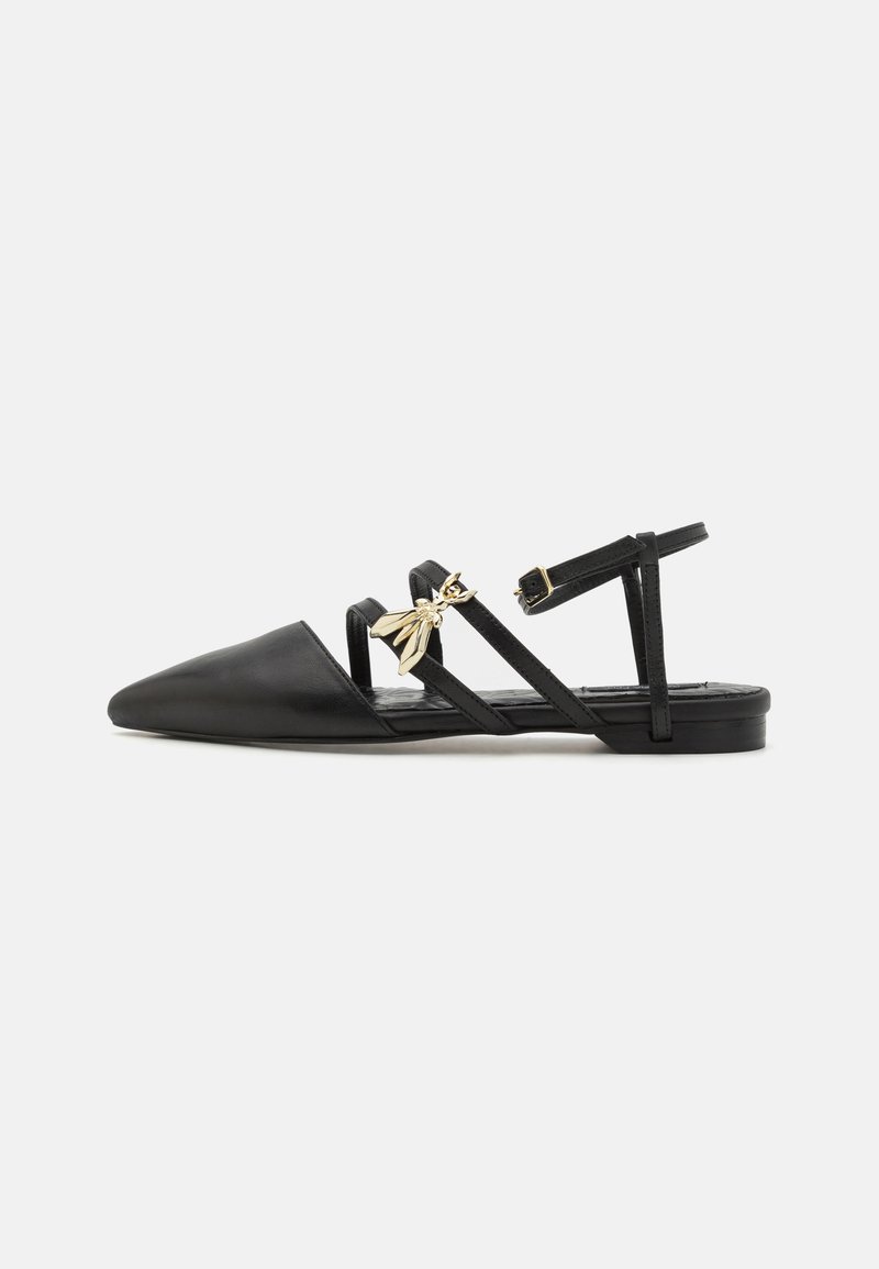 Black flat shoes with a pointed toe, made of smooth leather. Features crisscross straps and a decorative gold bee charm.