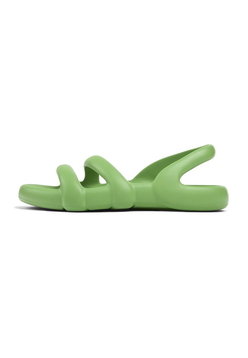 Green rubber sandals with curvy straps, open design, and a thick sole, offering a flexible and textured appearance.