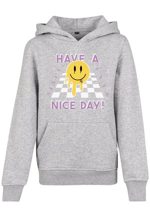 Sweatshirt à capuche gris avec poche avant, présentant un visage souriant jaune fondant et le texte "Passe une bonne journée !" sur un fond à carreaux.