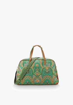 Green patterned travel bag featuring ornate floral designs, brown leather handles, and an adjustable striped shoulder strap.