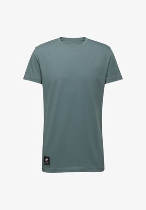 T-shirt a maniche corte di un colore teal tenue, realizzato in tessuto morbido, con un collo rotondo e un piccolo etichetta nera sul bordo.