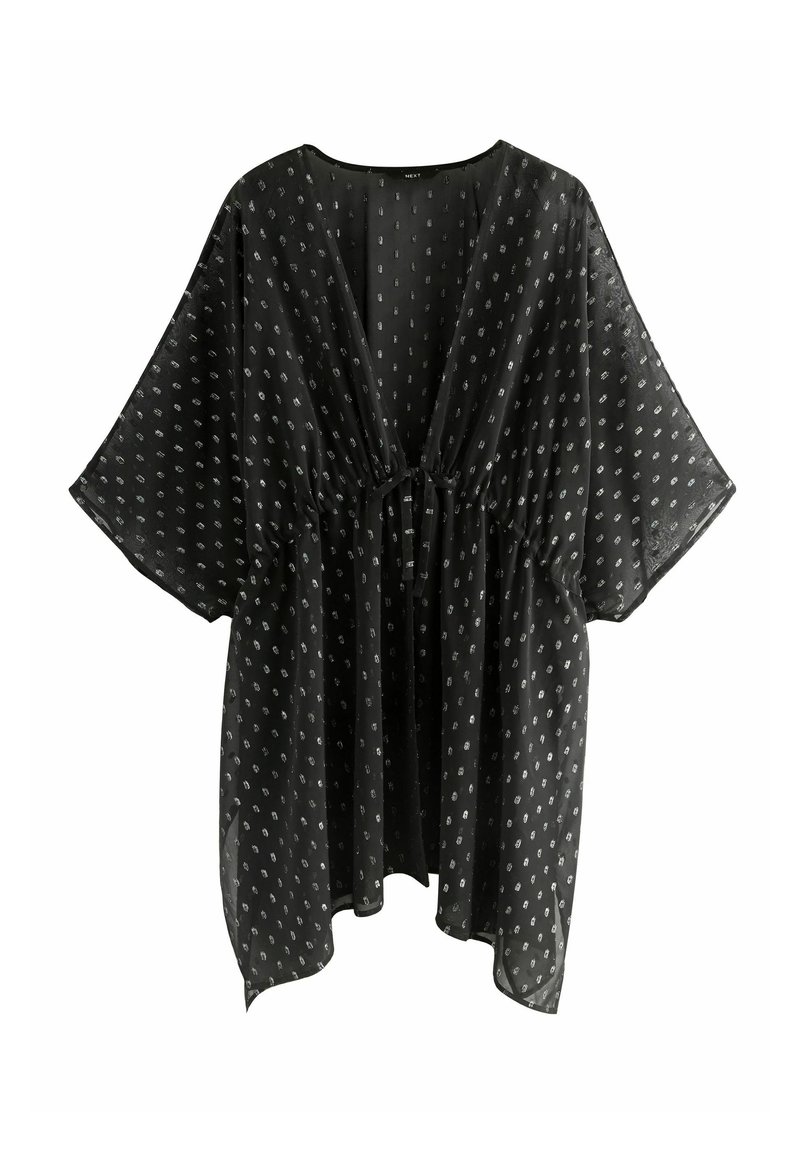 Crna prozirna bluzica kimono stila s dubokim V-izrezom, kratkim rukavima, elastičnim strukom i bijelim točkicama po cijeloj tkanini.