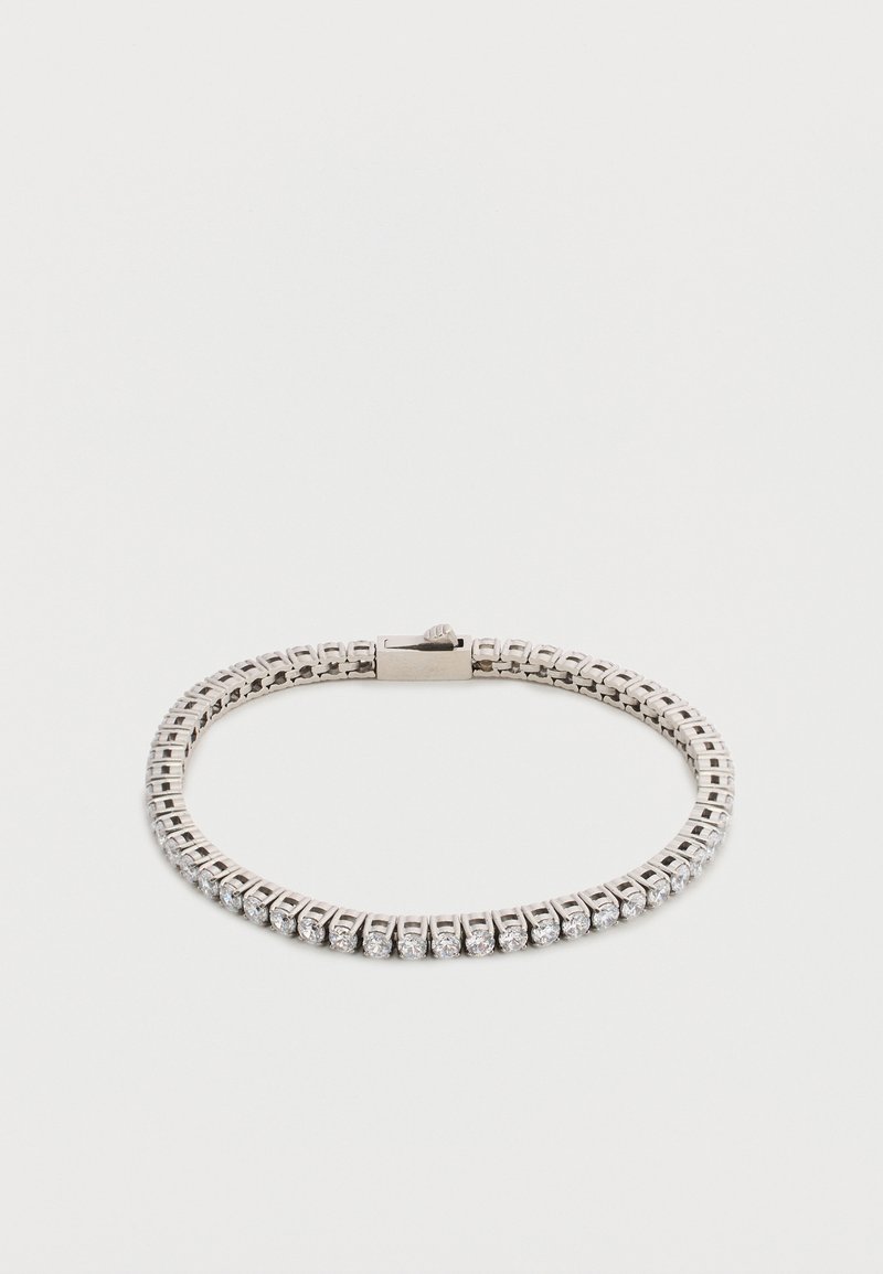 Ασημένιο βραχιόλι τένις με κούμπωμα, διαθέτει μία σειρά από μικρές στρογγυλές διάφανες πέτρες.