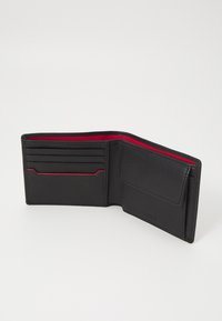 Black leather wallet with red interior. Features multiple card slots and a pocket for bills or coins. Smooth texture with minimal detailing.